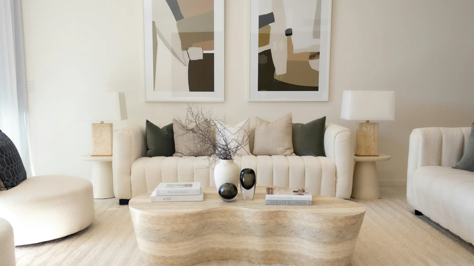 Design inspiration: an elegant neutral living room with sculptural seating and warm architectural details.